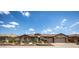 Stunning exterior view of home showcasing manicured landscaping, decorative rock, and a welcoming front yard at 41607 N Club Pointe Dr, Phoenix, AZ 85086