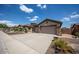 Charming home boasting a spacious three-car garage and well-maintained landscaping at 41607 N Club Pointe Dr, Phoenix, AZ 85086