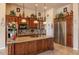 Chef's kitchen featuring a functional island, plenty of storage, and granite countertops at 41607 N Club Pointe Dr, Phoenix, AZ 85086