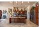 Gourmet kitchen with large central island, custom wood cabinetry, and stainless steel appliances at 41607 N Club Pointe Dr, Phoenix, AZ 85086