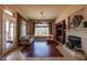 Cozy living room with fireplace, plush seating, and natural light streaming through large windows at 41607 N Club Pointe Dr, Phoenix, AZ 85086