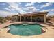 Enjoy the backyard's private pool, surrounded by a paved deck, ideal for relaxing and entertaining outdoors at 41607 N Club Pointe Dr, Phoenix, AZ 85086