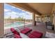 Enjoy outdoor living with a covered patio area overlooking a pool, perfect for relaxation and entertainment at 41607 N Club Pointe Dr, Phoenix, AZ 85086