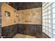 Tile shower with multiple shower heads, a seat, and a glass block window at 41607 N Club Pointe Dr, Phoenix, AZ 85086