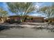 Stunning single-story home boasting mature desert landscaping and a welcoming three-car garage at 42211 N Long Cove Way, Anthem, AZ 85086