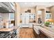 Well-equipped kitchen with stainless appliances, custom cabinets, and an island sink at 42211 N Long Cove Way, Anthem, AZ 85086