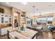 Open-concept living space with dining area, seamlessly connecting the kitchen, dining, and living areas at 42211 N Long Cove Way, Anthem, AZ 85086