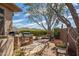 Outdoor kitchen featuring a built-in grill, mountain views and patio area at 42211 N Long Cove Way, Anthem, AZ 85086