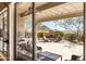 Cozy outdoor patio with a stone fireplace and comfortable seating area at 42211 N Long Cove Way, Anthem, AZ 85086