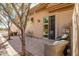 Inviting brick patio with comfortable seating and sliding glass doors at 42211 N Long Cove Way, Anthem, AZ 85086