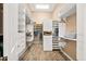 Spacious walk-in closet with custom shelving, drawers, and ample storage space for an organized wardrobe at 42211 N Long Cove Way, Anthem, AZ 85086