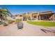 Beautiful backyard showcasing artificial grass, desert landscaping, and comfortable seating at 6202 E Mckellips Rd # 171, Mesa, AZ 85215