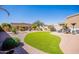 Expansive backyard featuring artificial grass, desert landscaping, and privacy wall at 6202 E Mckellips Rd # 171, Mesa, AZ 85215