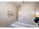 Bright bedroom features double door closet and view to the ensuite bathroom at 6202 E Mckellips Rd # 171, Mesa, AZ 85215