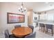 Dining area with wood table, grey chairs, and stylish decor at 6202 E Mckellips Rd # 171, Mesa, AZ 85215