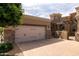 Elegant home featuring a spacious garage and a beautifully paved driveway at 6202 E Mckellips Rd # 171, Mesa, AZ 85215