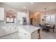 Bright kitchen featuring white cabinets, marble countertops, stainless steel appliances and tile flooring at 6202 E Mckellips Rd # 171, Mesa, AZ 85215