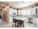 Modern kitchen featuring white cabinets, stainless steel appliances, and a marble backsplash at 6202 E Mckellips Rd # 171, Mesa, AZ 85215