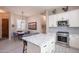 Bright kitchen featuring white cabinets, marble countertops, stainless steel appliances and tiled backsplash at 6202 E Mckellips Rd # 171, Mesa, AZ 85215