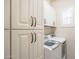 Convenient laundry room with modern washer and dryer and lots of cabinet space at 6202 E Mckellips Rd # 171, Mesa, AZ 85215