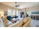 Spacious living room with neutral decor, tile floors, and multiple seating arrangements at 6202 E Mckellips Rd # 171, Mesa, AZ 85215