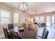 Spacious living area with elegant dining table, comfortable seating, and abundant natural light at 6202 E Mckellips Rd # 171, Mesa, AZ 85215