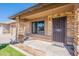 Inviting front entrance with security door and stone pillar accents at 6414 W Monterey Pl, Chandler, AZ 85226
