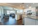Modern kitchen with stainless steel appliances and open floor plan to the living room at 6414 W Monterey Pl, Chandler, AZ 85226