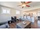 Open living space connecting to a modern kitchen and bar seating at 6414 W Monterey Pl, Chandler, AZ 85226