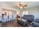 Open-concept living room featuring modern gray sofas and a breakfast bar with pendant lighting at 6414 W Monterey Pl, Chandler, AZ 85226