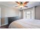 Comfortable bedroom with neutral walls, wood floors, and bright natural light at 6414 W Monterey Pl, Chandler, AZ 85226