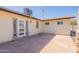 Spacious backyard patio area featuring flagstone pavers and access to the home's interior at 6414 W Monterey Pl, Chandler, AZ 85226