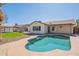 Inviting pool with a pebble tec finish, surrounded by lush landscaping and a view of the home's exterior at 6414 W Monterey Pl, Chandler, AZ 85226