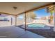Backyard patio with view of swimming pool, privacy wall and desert landscaping at 6414 W Monterey Pl, Chandler, AZ 85226