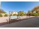 Backyard featuring desert landscaping, a swing, and mature trees, perfect for outdoor enjoyment at 6456 E Orion St, Mesa, AZ 85215