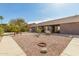 Beautiful desert landscaped backyard with a swing and plenty of room to roam at 6456 E Orion St, Mesa, AZ 85215