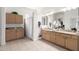 Bathroom with granite counters, double sinks, and a shower at 6456 E Orion St, Mesa, AZ 85215