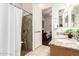 Bathroom with granite counter, sink, and open door to bedroom at 6456 E Orion St, Mesa, AZ 85215
