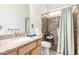 Accessible bathroom features a walk-in shower, granite countertops, and modern fixtures at 6456 E Orion St, Mesa, AZ 85215