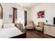 Bedroom showcasing wood floors, seating, and a dresser at 6456 E Orion St, Mesa, AZ 85215