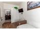 Functional bedroom with wood-look floors, mounted TV, sliding-door closet, and hospital bed at 6456 E Orion St, Mesa, AZ 85215