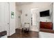 Bedroom featuring open doors to the hallway and bathroom at 6456 E Orion St, Mesa, AZ 85215