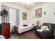 Bedroom featuring wood floors, artwork, and seating at 6456 E Orion St, Mesa, AZ 85215