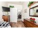 Bedroom featuring laminate floors, neutral walls, a dresser, and a sliding-door closet at 6456 E Orion St, Mesa, AZ 85215