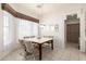 Bright dining area with tile floors, a marble table, and comfortable upholstered chairs at 6456 E Orion St, Mesa, AZ 85215