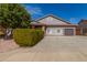 Charming single-Gathering home featuring a two-car garage, manicured landscaping and a tile roof at 6456 E Orion St, Mesa, AZ 85215