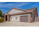 Charming single-Gathering home featuring a two-car garage and a tile roof with solar panels at 6456 E Orion St, Mesa, AZ 85215