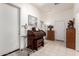 This well-lit hallway features tile floors, neutral walls, and multiple doors for easy access at 6456 E Orion St, Mesa, AZ 85215
