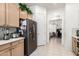 Kitchen featuring stainless steel refrigerator and light wood cabinets at 6456 E Orion St, Mesa, AZ 85215