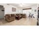 Spacious living room featuring tile floors, natural light, and comfortable seating at 6456 E Orion St, Mesa, AZ 85215